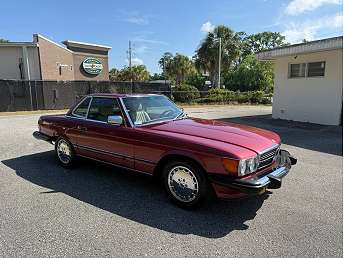 Red Mercedes-Benz 560 SL 1989
